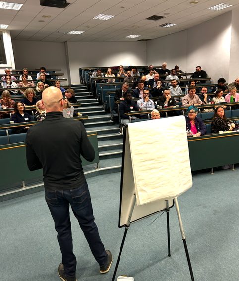 Pete presenting to a full lecture theatre